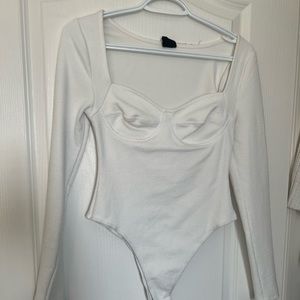 WHITE BUSTIER CUP BODYSUIT.